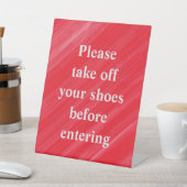 "Bitte ziehen Sie Ihre Schuhe aus, bevor Sie einst Sockelschild (In SItu)