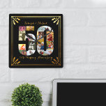 Black and Gold Foto zum 50. Hochzeitstag Quadratische Wanduhr<br><div class="desc">Erstellen Sie Ihre eigene 50. Hochzeit-Jubiläumswand mit einigen Ihrer Lieblingssendungen aus den letzten 50 Jahren. Dieses elegante Schwarz-Gold-Design verfügt über eine 50-förmige Foto-Collage mit einem Kunstrahmen im Deko-Stil und verzierter Schriftzeichen-Typografie. Die Foto-Collage enthält Platz-, Landschafts- und Portraitbilder, um Ihnen viele Möglichkeiten für die Platzierung zu bieten. Die Vorlage ist Set...</div>