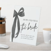 Black Bow, wie alt das Brautparty der Braut war Sockelschild (In SItu)