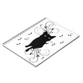 Black Cat Surrounded by Whispering Notes of Music Notizblock (Linke Seite)