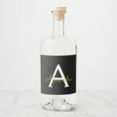 Black Gold Modernes Script Giron Monogram Name Alkoholflaschenetikett (Vorderseite)