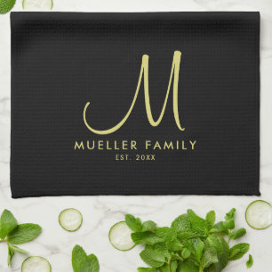 Black Gold Monogram Family Name Moderne Elegant Geschirrtuch