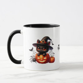 Black Kitten in einem Halloween-Kürbis Tasse