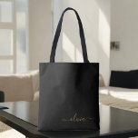 Black Name Gold Girly Script Monogram Modern Tasche<br><div class="desc">Schwarz und Gold Elegant Fügen Sie Ihren eigenen Namen Monogram Book Bag. Diese Büchertasche kann auf Ihren Vor- und Vornamen angepasst werden und als Geschenk für Weihnachten,  Geburtstag,  Brautparty oder Hochzeit.</div>