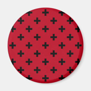 Black polka crosses on red magnet