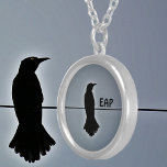 Black Raven Silhouette mit Initials Versilberte Kette<br><div class="desc">Ein einsamer Rabe, der auf einem Draht in schwarzer Silhouette gegen einen grauen Himmel auf dieser gotischen, fantasievollen Halskette steht. In der Geschichte und den Weltkulturen findet sich der Rabe in Erzählung, Mythologie und Literatur. Die Symbolik des Rabe ist vielfältig. Es ist großartig für Vogelliebhaber und Fans von Edgar Allen...</div>