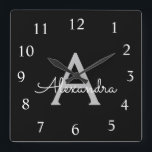 Black Silver Modern Script Girl Monogram Name Quadratische Wanduhr<br><div class="desc">Silver und Black Script Monogram Name Clock. Das macht den perfekten 16 Geburtstag,  Hochzeit,  Brautparty,  Jubiläum,  Babydusche oder Junggeselinnen-Abschied Geschenk für jemanden,  der Lieben glamourösen Luxus und schicke Stile.</div>
