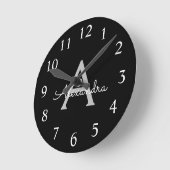 Black Silver Modern Script Girl Monogram Name Runde Wanduhr (Winkel)