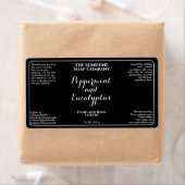 Black w white curly text cosmetics bottle label (Insitu)