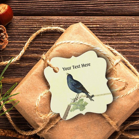 Blackbird singen in der Raupe des Zweiges auf Gelb Geschenkanhänger