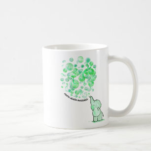 Bläst grüne Ballons für psychische Gesundheit Kaffeetasse