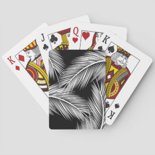 Blätter mit weißer Handfläche auf schwarzem Hinter Spielkarten