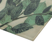 Blätter und Verzweigungen auf dem Hintergrund der  Schneidebrett (Ecke)