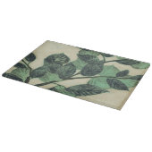 Blätter und Verzweigungen auf dem Hintergrund der  Schneidebrett (Ecke)