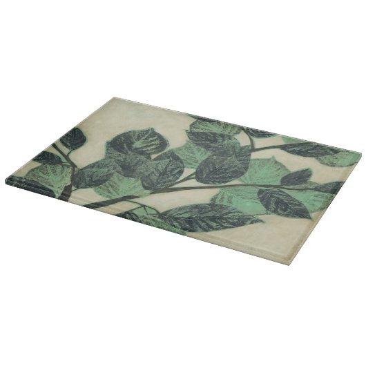 Blätter und Verzweigungen auf dem Hintergrund der  Schneidebrett (Ecke)