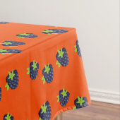 Blaubeerenfruchtmuster auf Orange Tischdecke (Beispiel)