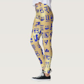 Blaue antike ägyptische Hieroglyphen auf Gold Leggings (Links)