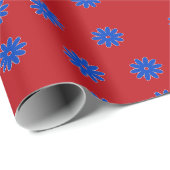 Blaue Blume in Rot Geschenkpapier (Rolleneckpunkt)