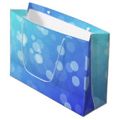 Blaue Geschenktasche mit weißen Seilgriffen Große Geschenktüte (Vorderseite Schrägansicht)