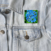Blaue Hydrangea-Blume und ihre grünen Blätter Button (Beispiel)