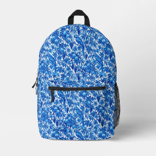 Blaue Papageien in einem tropischen Garten Bedruckter Rucksack