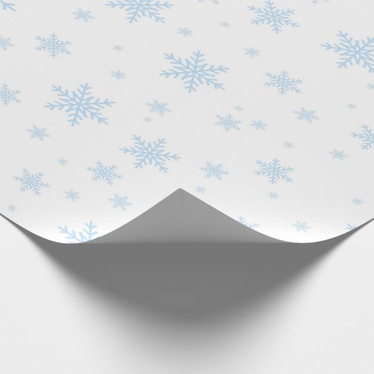 Blaue Schneeflocken in Weiß Geschenkpapier (Ecke)