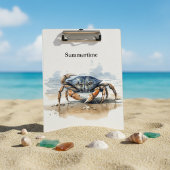 Blaue und orangefarbene Krabbe am Strand Klemmbrett