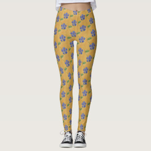 Blaue Vinca, Perwinkl auf einem gelben Hintergrund Leggings
