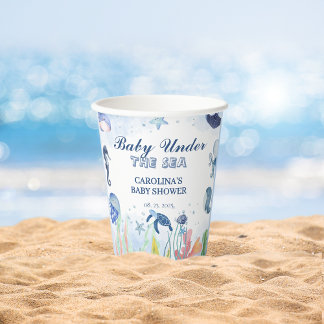 Blaue Wasserfarbe unter der Babydusche des Meeres Pappbecher