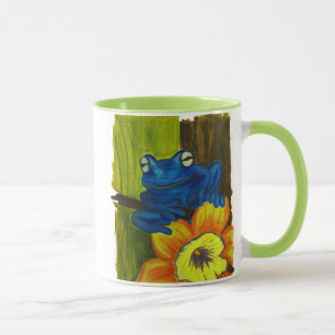 Blauer Frosch, der auf Blumen- und Tasse