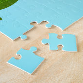 Blauer Himmelsverlauf mit blühendem Frühlingsarm Puzzle (Seite)