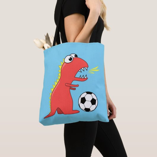 Blauer lustiger Cartoon-Dinosaurier-Fußball Tasche (Von Nahem)
