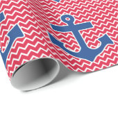 Blauer nautischanker auf rotem Zickzack Geschenkpapier (Rolleneckpunkt)