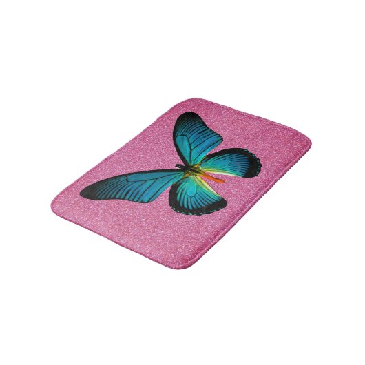 Blauer Schmetterling auf rosa Glitzer Badematte (Schrägansicht)