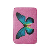 Blauer Schmetterling auf rosa Glitzer Badematte (Vorderseite Vertikal)