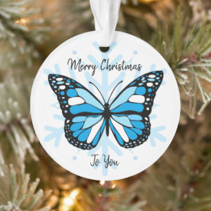 Blauer Schmetterling über Schneeflocken Weihnachte Ornament