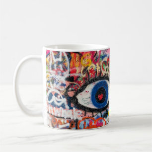 Blauer und rote Blumentextilien Kaffeetasse
