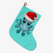 Blaues Baby-Krake, die eine Weihnachtsmannmütze Großer Weihnachtsstrumpf (Vorderansicht (hängend))