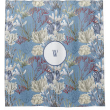 Blaues Monogramm unter den Meereskorallen