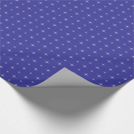 Blaues Packpapier mit funkelnden Sternen (Ecke)