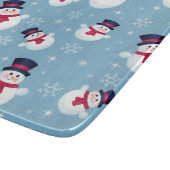 Blaues Weihnachtsmuster mit Schneemännern und Schneidebrett (Ecke)