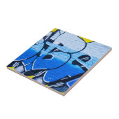 Blaugraffiti an einer Ziegelwand Fliese (Seite)