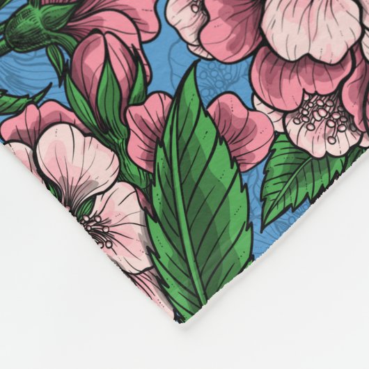 Blauzungenvögel im blühenden Kirschbaum auf blau Fleecedecke (Ecke)