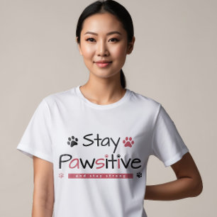 "Bleibe Pawsitive" Inspirationsdesign mit spieleri T-Shirt