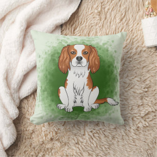 Blenheim Cavalier King Charles Spaniel auf Grün Kissen