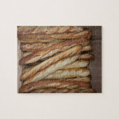 Blick auf Brotlaibe in Bäckereifenstern Puzzle (Horizontal)