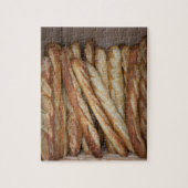 Blick auf Brotlaibe in Bäckereifenstern Puzzle (Vertikal)