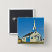 Blick auf eine blaue und weiße Kirche im Stamm der Button (Vorne & Hinten)