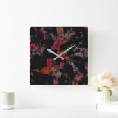 Blinkende rote Flecken auf dunkelgrauem Felsunterg Quadratische Wanduhr (Zuhause)