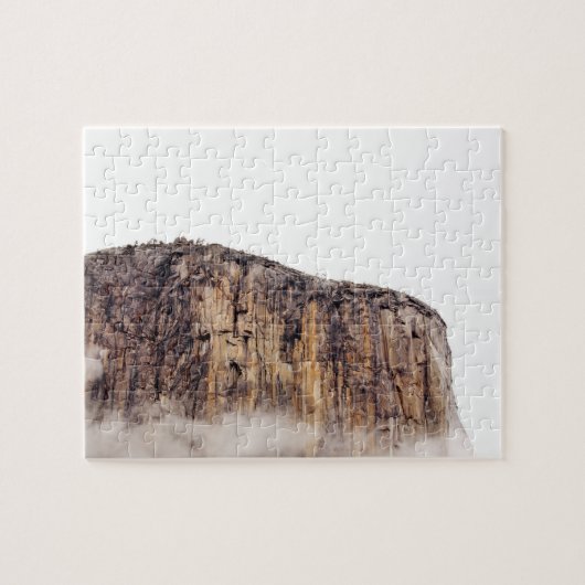 Bloße Klippe, die über Wolken steigt Puzzle (Horizontal)